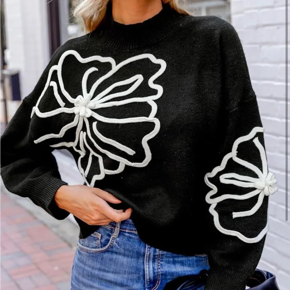 Chic Black Sweater with White Floral Design small